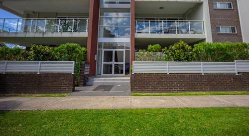 Front yard lawn and small rail garden for multi-unit dwelling