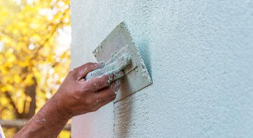 Plastering an outside wall