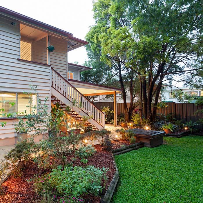 Old Queenslander with immaculate lawn, outdoor areas and garden