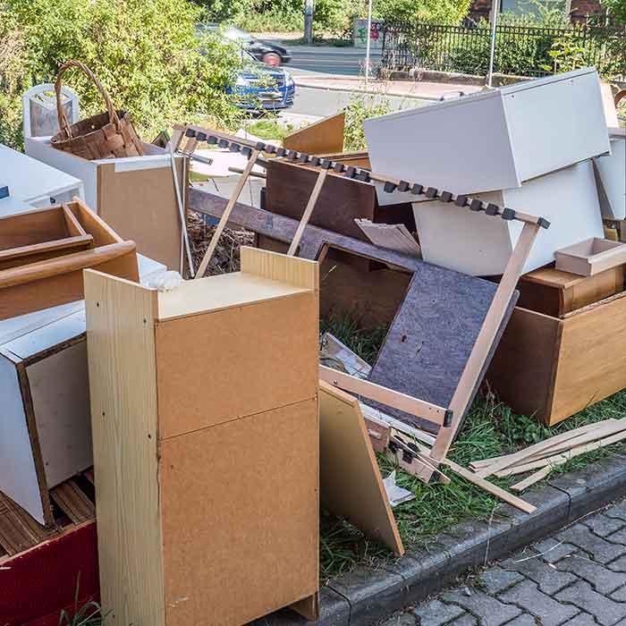 Pile of old furniture and household items ready to go to the dump