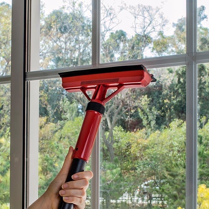 Cleaning home window with steam